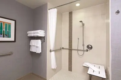 a bathroom with a shower and a sink at Hyatt Place at Anaheim Resort / Convention Center in Anaheim