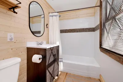 a bathroom with a sink and a toilet and a mirror at Cozy fox #2035 in Big Bear Lake