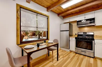 a kitchen with a wooden table and a window at Cozy fox #2035 in Big Bear Lake