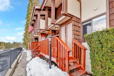 a house with snow on the side of it at Smith summit chalet #2461 in Big Bear Lake