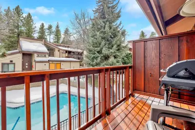 a balcony with a pool and a grill at Smith summit chalet #2461 in Big Bear Lake