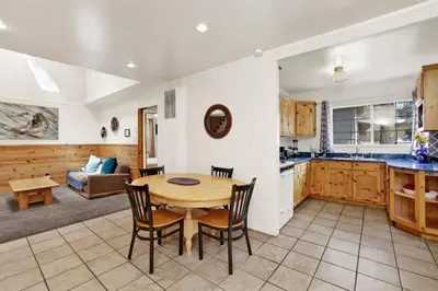 a kitchen and living room with a table and chairs at Life of riley #1608 in Big Bear Lake
