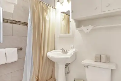 a white bathroom with a sink and a toilet at Life of riley #1608 in Big Bear Lake