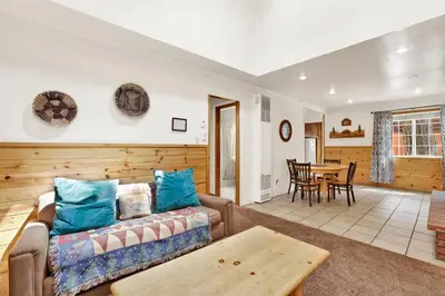 a living room with a couch and a table at Life of riley #1608 in Big Bear Lake