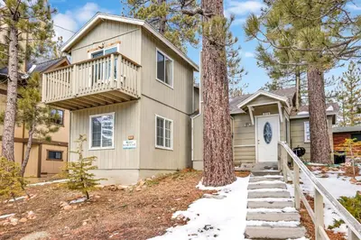 a house with a balcony and a tree at Life of riley #1608 in Big Bear Lake