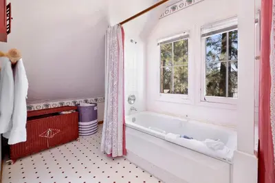 a bathroom with a tub and a window at JUS' RESTIN #265 in Big Bear Lake