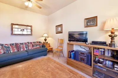 a living room with a couch and a tv at JUS' RESTIN #265 in Big Bear Lake