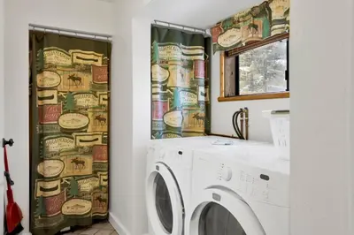 a laundry room with a washer and dryer at Pleasant Pause#1864 in Fawnskin