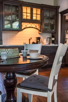 a wooden table with two chairs and a dining room at Soaring pines #2193 in Big Bear Lake