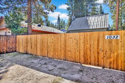 a wooden fence in front of a house at The weekender #2342 in Big Bear City