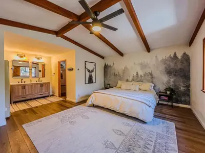 a bedroom with a bed and a painting on the wall at The lost compass #2165 in Big Bear Lake