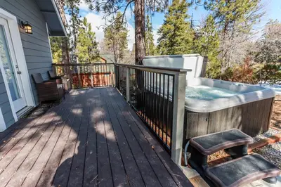 a wooden deck with a hot tub on a house at Mountain modern #1743 in Big Bear Lake