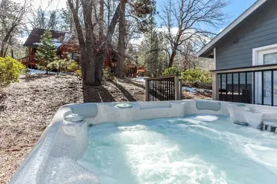 a jacuzzi tub in the yard of a house at Mountain modern #1743 in Big Bear Lake
