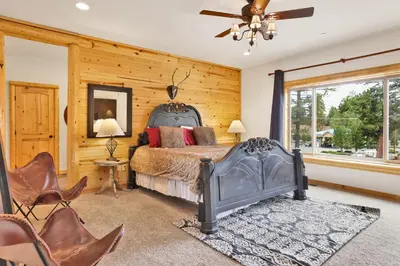 a bedroom with a bed and a ceiling fan at Eagle ridge views #1648 in Big Bear Lake
