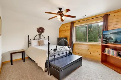 a bedroom with a bed and a ceiling fan at Eagle ridge views #1648 in Big Bear Lake
