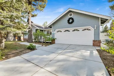 a house with a driveway and a white garage at Divine chateau #2357 in Big Bear Lake