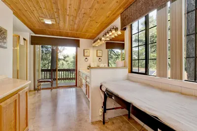 a large kitchen with a wooden ceiling and windows at Knickerbocker retreat #2321 in Big Bear Lake