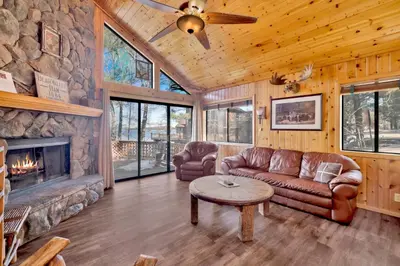 a living room with a couch and a fireplace at Lake shore #012 in Big Bear Lake