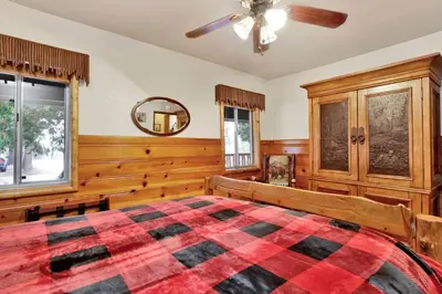 a bedroom with a bed and a ceiling fan at Timber pines chalet #2417 in Big Bear Lake