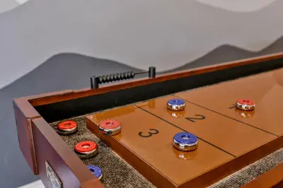 a wooden table with a game of billiards at Majestic sky retreat #2090 in Big Bear Lake