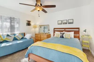 a bedroom with two beds and a ceiling fan at Majestic sky retreat #2090 in Big Bear Lake