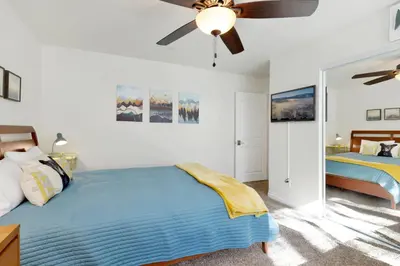 a bedroom with a bed and a ceiling fan at Majestic sky retreat #2090 in Big Bear Lake