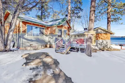 a log cabin in the snow with a porch at Lonepine#107 in Big Bear Lake