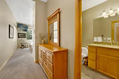a bathroom with a large mirror and a sink at Sunset ridge villa #2178 in Big Bear Lake