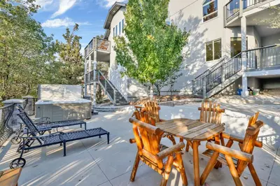 a patio with a wooden table and chairs at Sunset ridge villa #2178 in Big Bear Lake