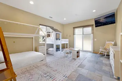 a bedroom with a bed and a bunk bed at Sunset ridge villa #2178 in Big Bear Lake