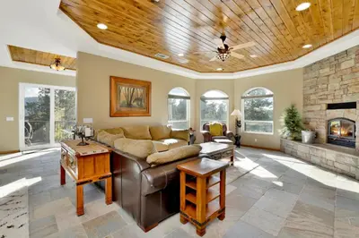 a living room with a couch and a fireplace at Sunset ridge villa #2178 in Big Bear Lake