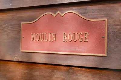 a sign that reads mountain ridge on a wooden wall at Moulin rouge #2055 in Big Bear Lake