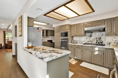 a kitchen with wooden cabinets and a large island at Mountain fun #1729 in Big Bear Lake