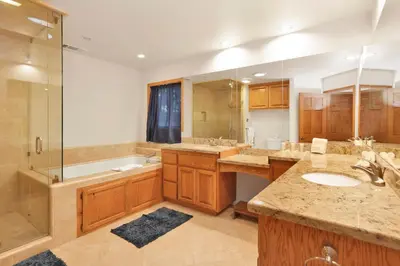 a large bathroom with two sinks and a shower at Flitterbick lodge #2246 in Fawnskin