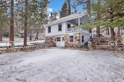 a house in the woods with a driveway at Pinglewood cabin #2096 in Fawnskin