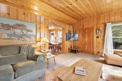 a living room with a couch and a table at Pinglewood cabin #2096 in Fawnskin