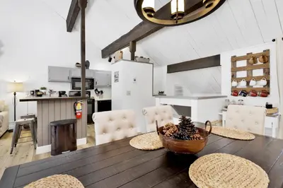 a kitchen and dining room with a table and chairs at Switzerland slopes #2125 in Big Bear Lake