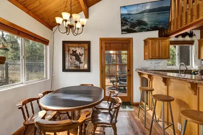 a kitchen with a table and chairs in a room at Mountain adventure #1931 in Big Bear Lake