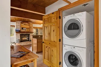 a laundry room with a washer and dryer in a cabin at Mountain adventure #1931 in Big Bear Lake