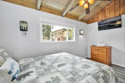 a bedroom with a bed and a window at Storyville #2294 in Big Bear Lake