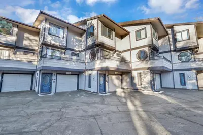 a large apartment building with two garage doors at Forest shores lake view condo #2250 in Big Bear Lake