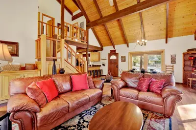 a living room with leather couches and a wooden ceiling at All season alpine retreat #1184 in Big Bear Lake
