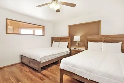 a bedroom with two beds and a ceiling fan at The octagon #2394 in Big Bear City