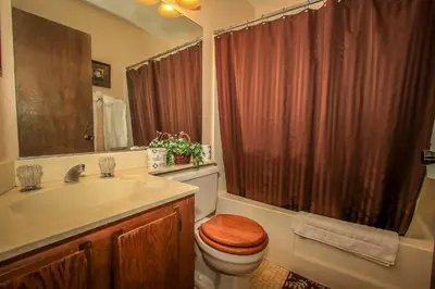 a bathroom with a toilet and a sink and a shower at Boulder creek #1412 in Big Bear Lake