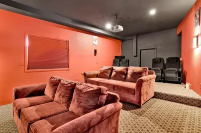 a living room with two chairs and a couch at The grand chalet #1989 in Big Bear Lake
