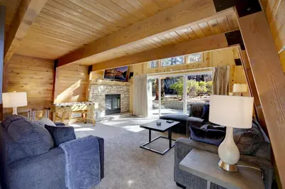 a living room with two couches and a fireplace at Switzerland ski chalet #845 in Big Bear Lake
