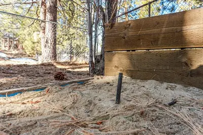 a wooden wall in the middle of a forest at Pines 23 #1438 in Big Bear Lake