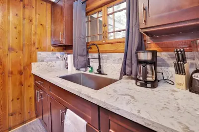 a kitchen with a sink and a counter top at Shore acres lodge #451 in Big Bear Lake
