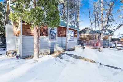 a house with snow on the ground at Lupine #106 in Big Bear Lake