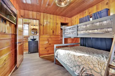 a bedroom with two bunk beds in a cabin at Lupine #106 in Big Bear Lake
